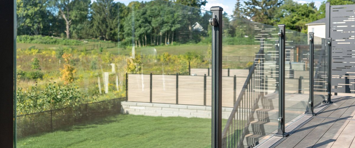 Glass railing overlooking backyard